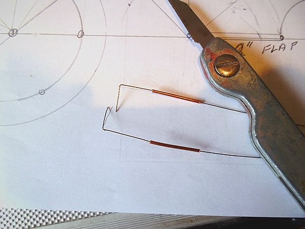 control lines with bent ends and colour coded heat shrink tubing